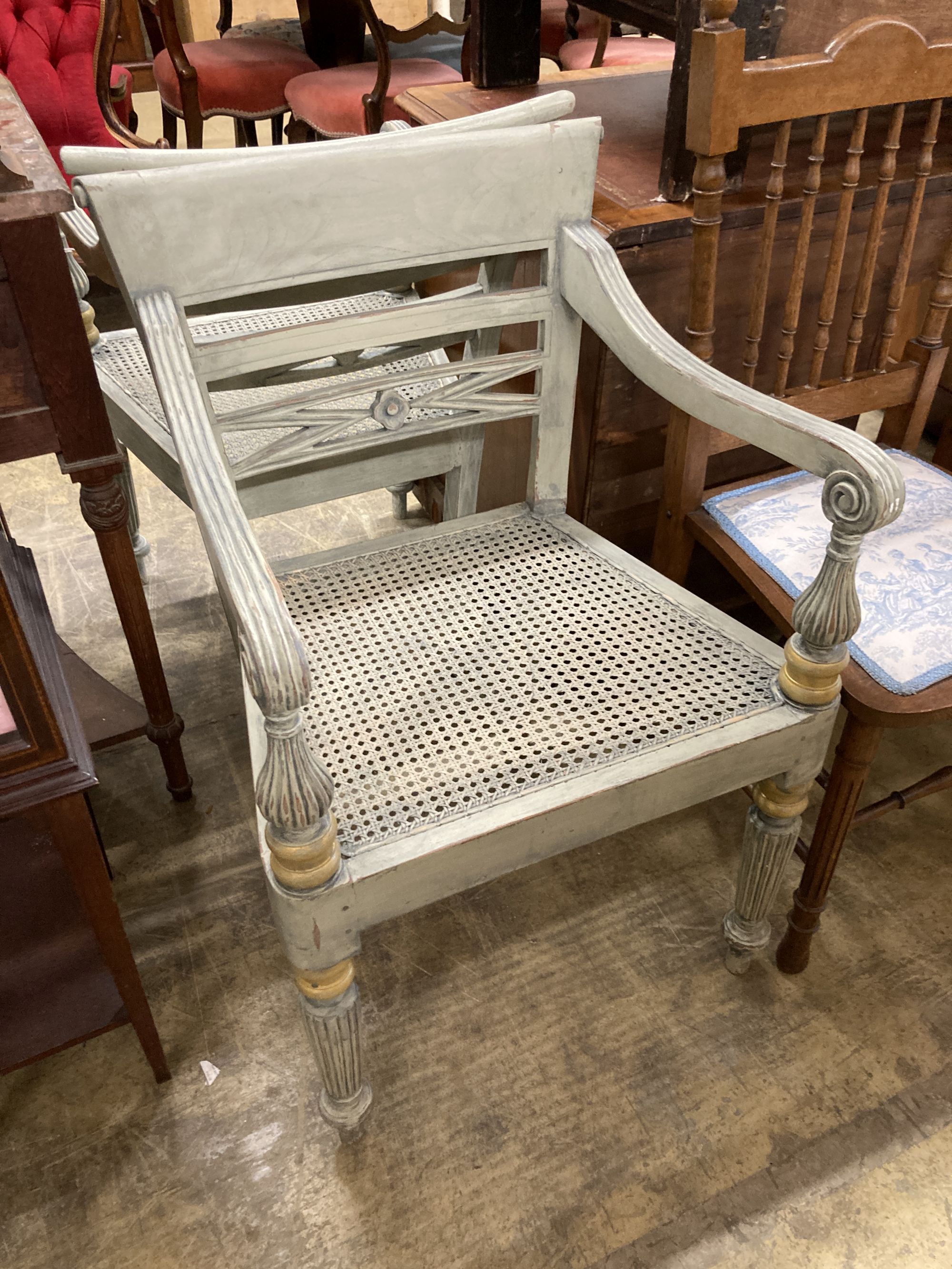 A pair of Dutch colonial style painted cane seat dining chairs, width 55cm, depth 50cm, height 86cm